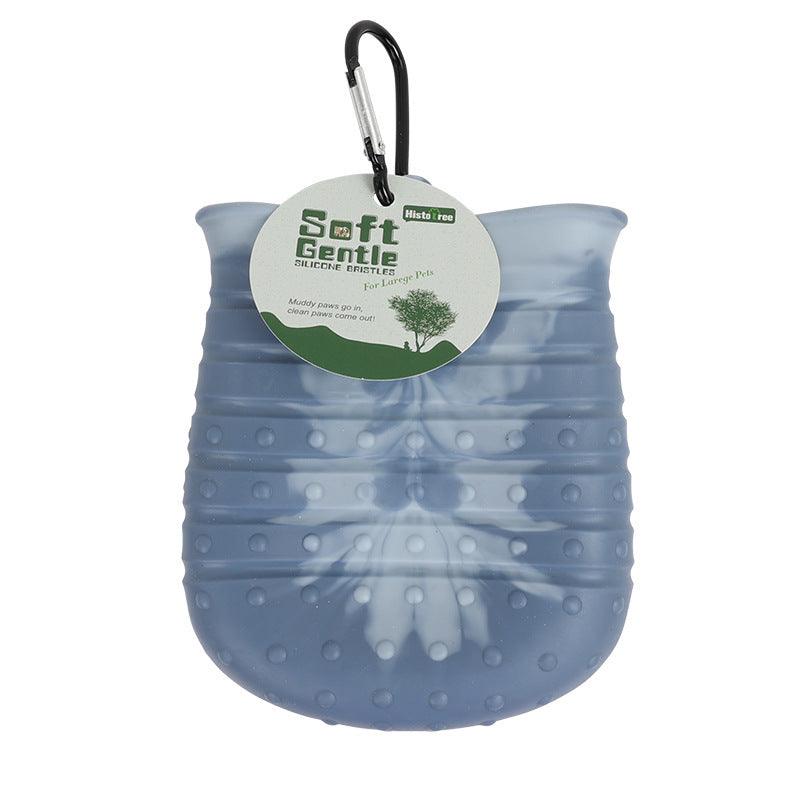 Portable dog paw cleaner cup with silicone bristles for easy pet foot washing and grooming.